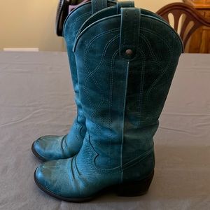 Turquoise leather boots. 2 inch heel. 6 inch calf and 13 inch shaft.